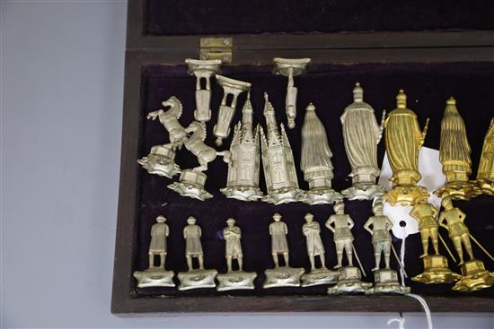 A figural silvered and gilded metal chess set in fitted rosewood and boxwood folding box/chess board, c.1860, Board size : 31cm x 31 cm